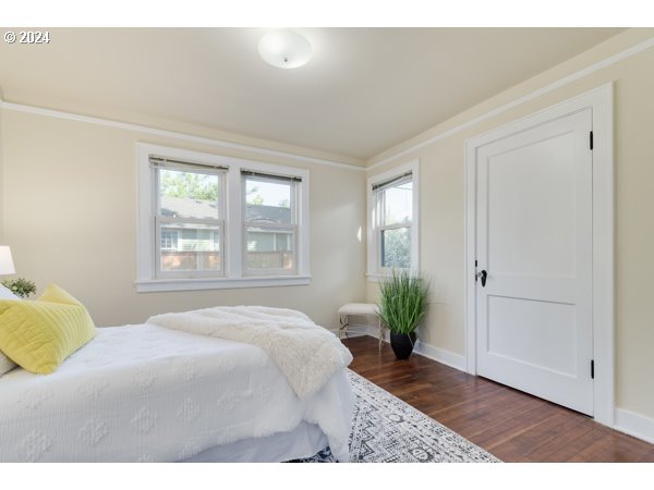 647 5th Street Springfield, OR 97477 - Photo 22 of 40 a bedroom with a bed potted plant and windows