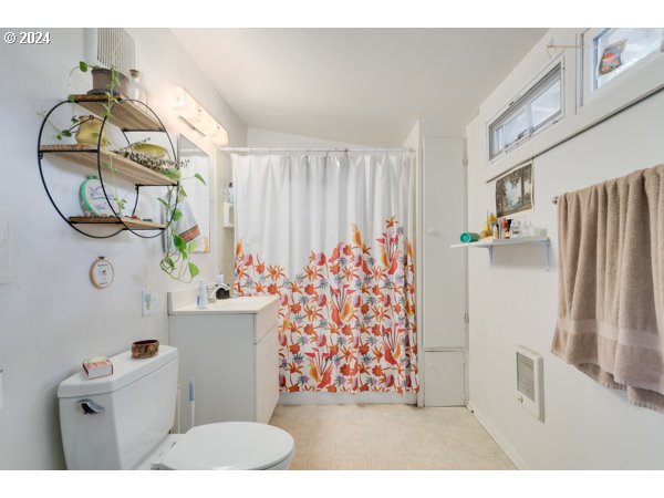 647 5th Street Springfield, OR 97477 - Photo 31 of 40 a bathroom with a sink toilet and shower