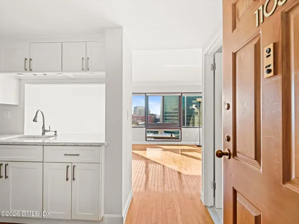 a view of a kitchen from the hallway
