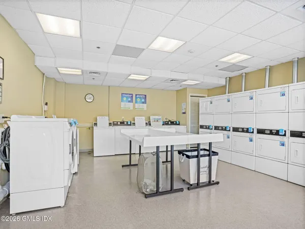 a kitchen with cabinets and white appliances