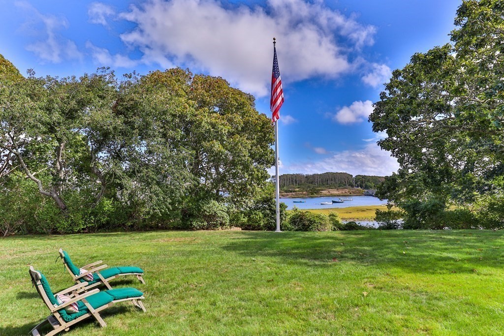 513 Stage Harbor Road Chatham, MA 02633 - Photo 3 of 42 a view of a garden with lawn chairs