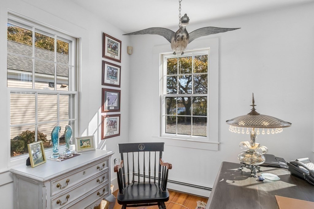 513 Stage Harbor Road Chatham, MA 02633 - Photo 35 of 42 a view of a room with a window and chandelier