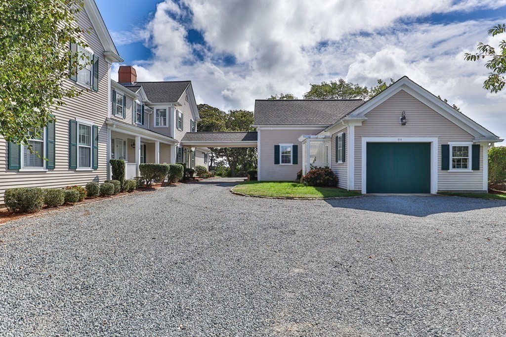 513 Stage Harbor Road Chatham, MA 02633 - Photo 5 of 42 a view of large house with a big yard and large trees