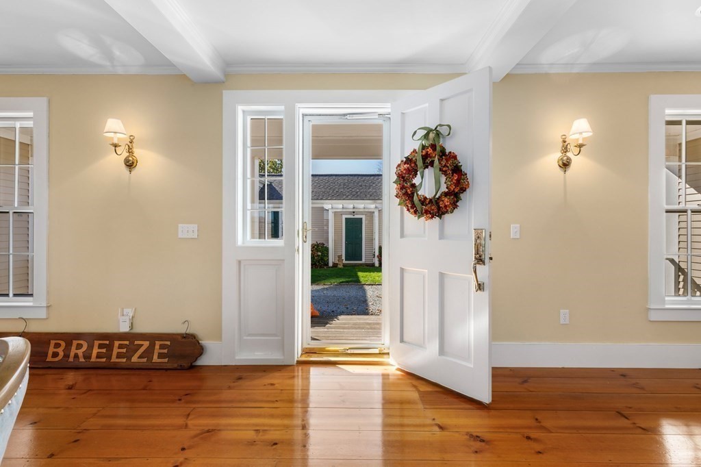 513 Stage Harbor Road Chatham, MA 02633 - Photo 6 of 42 a view of a livingroom with wooden floor and entryway