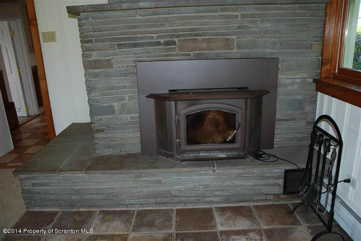 490 Orange Road Dallas, PA 18612 - Photo 9 of 29 a living room with a fireplace