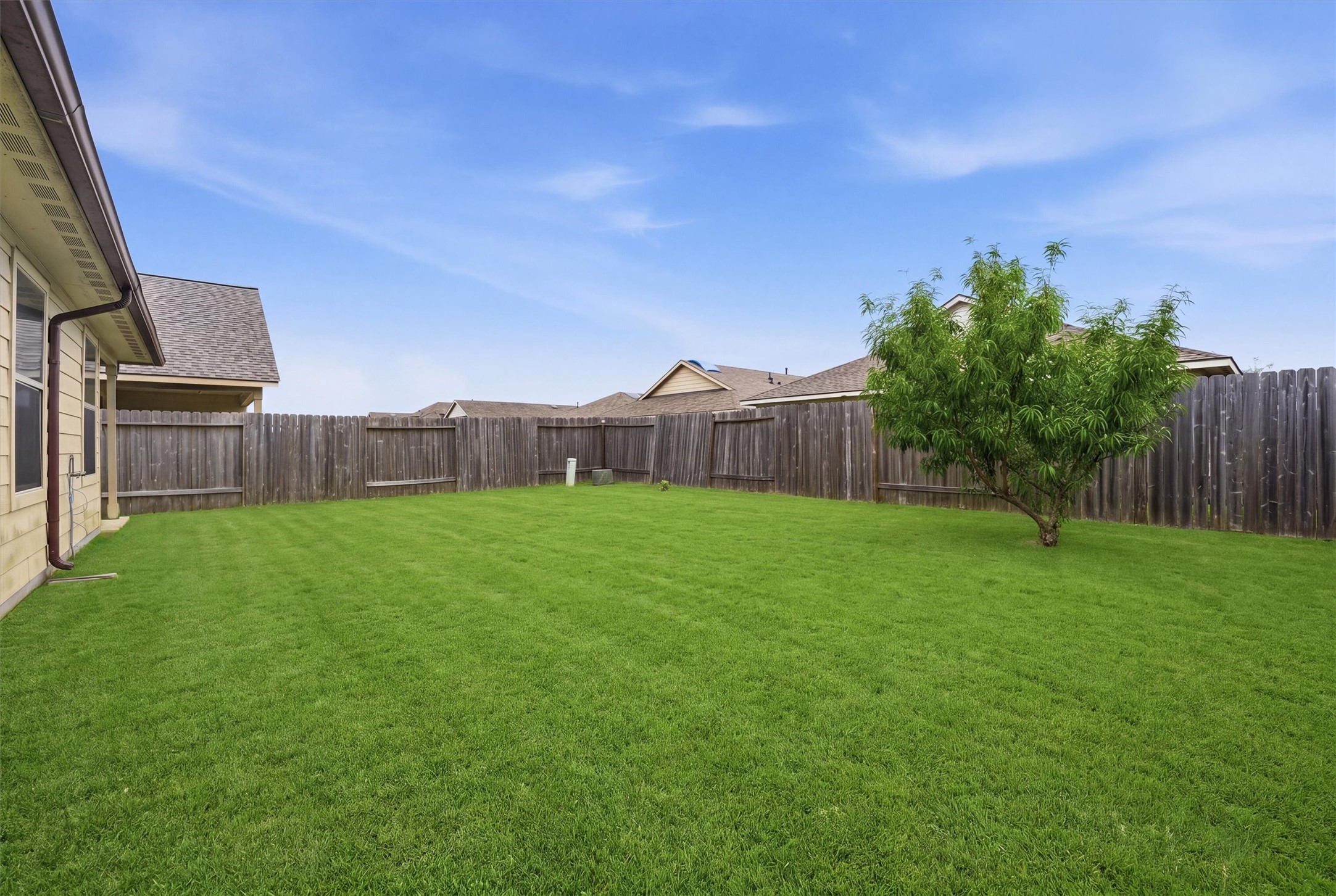 15455 Rancho Joya Way Houston, TX 77049 - Photo 19 of 20 a view of a house with backyard and a garden