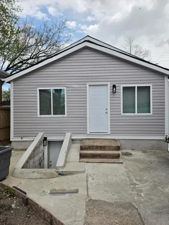 a view of a house with backyard space