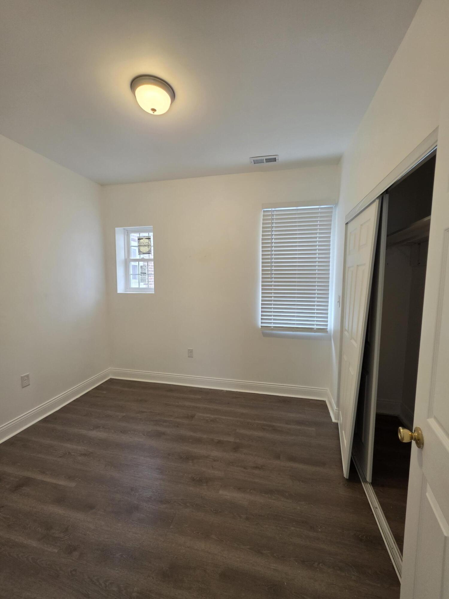 4149 Broadway Gary, IN 46409 - Photo 15 of 26 a view of an empty room with wooden floor and a window