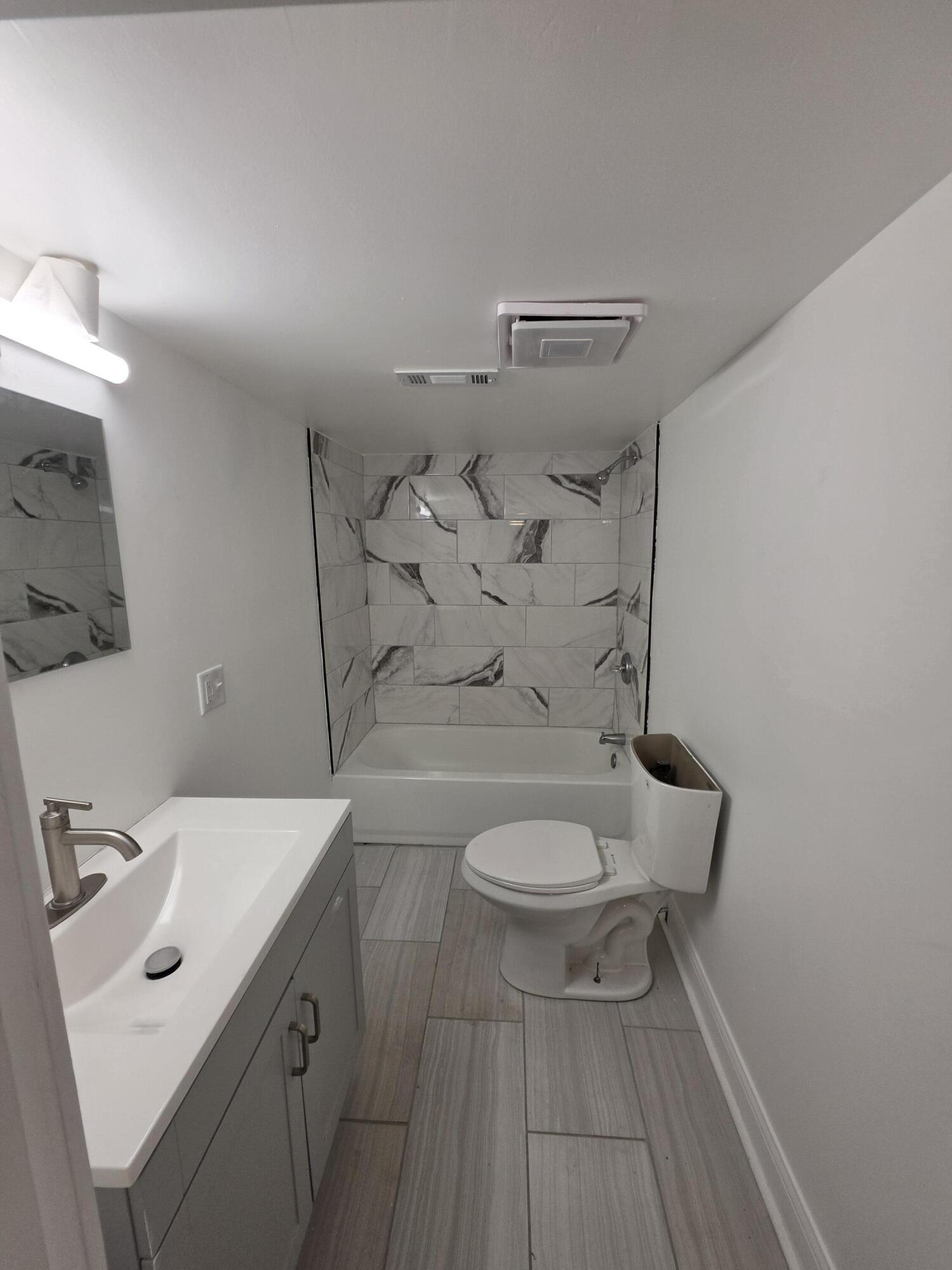 4149 Broadway Gary, IN 46409 - Photo 19 of 26 a bathroom with a sink a toilet and shower