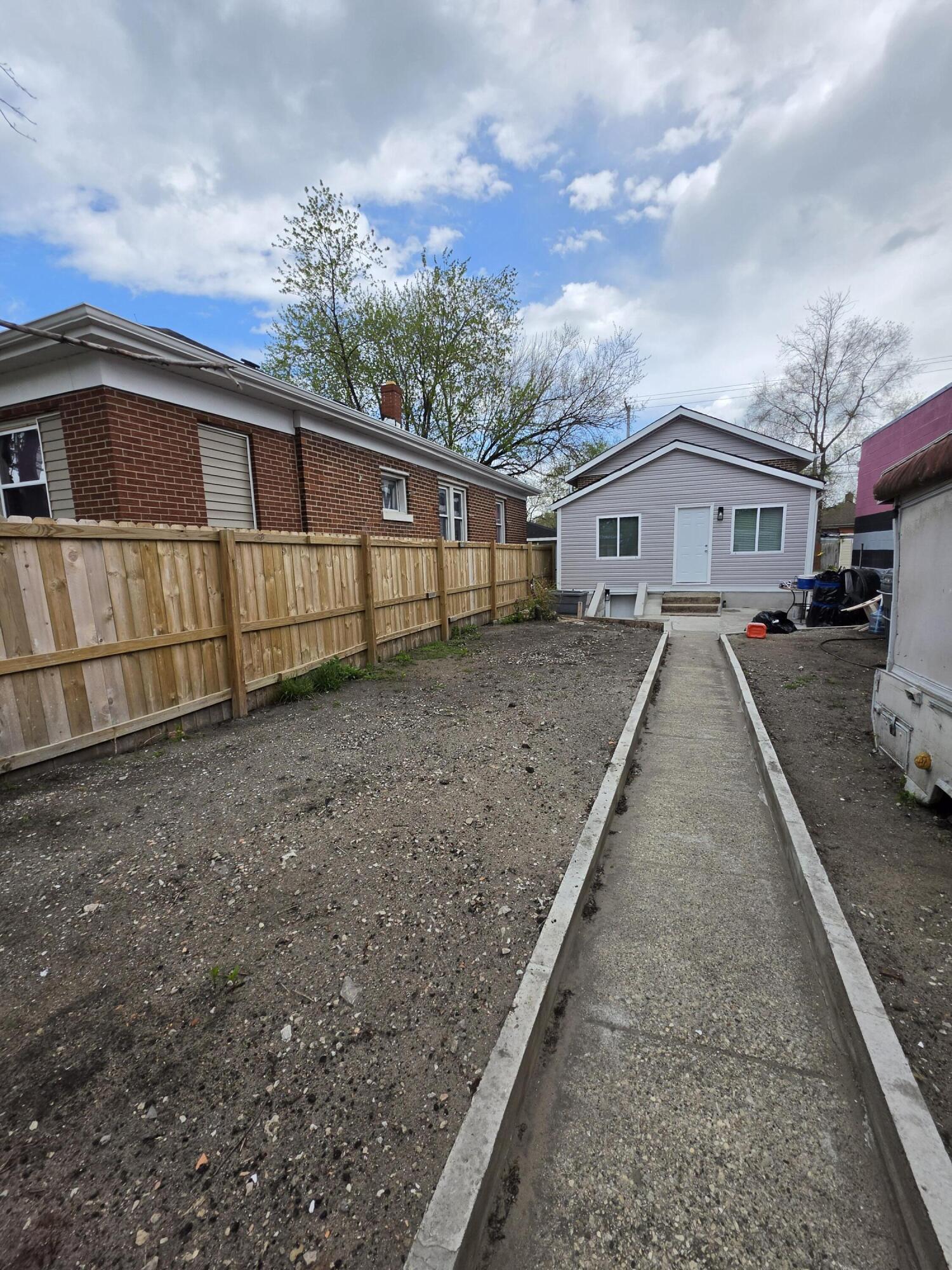 4149 Broadway Gary, IN 46409 - Photo 2 of 26 a view of a house with a backyard