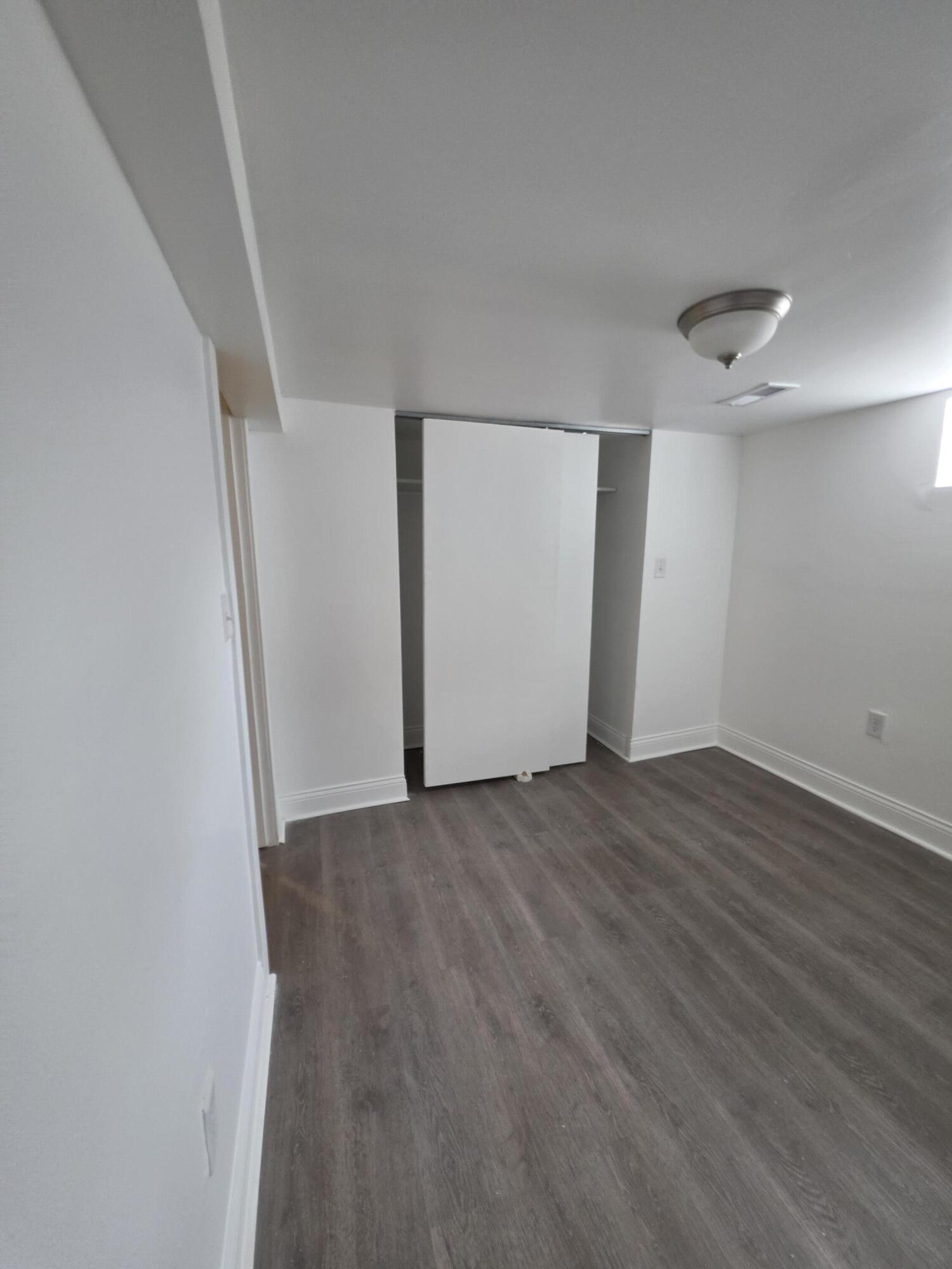 4149 Broadway Gary, IN 46409 - Photo 21 of 26 an empty room with wooden floor and windows