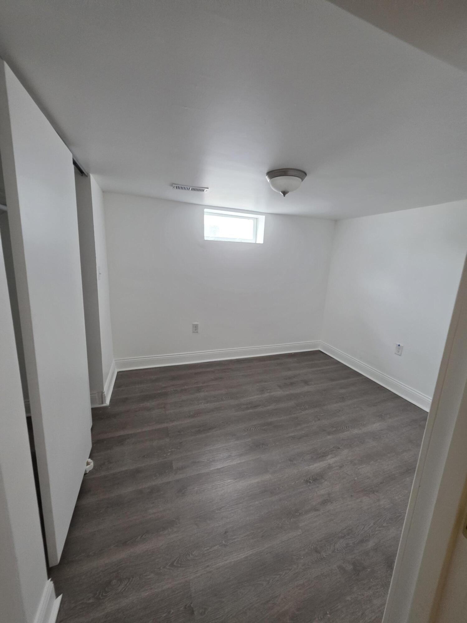 4149 Broadway Gary, IN 46409 - Photo 23 of 26 an empty room with wooden floor and entrance