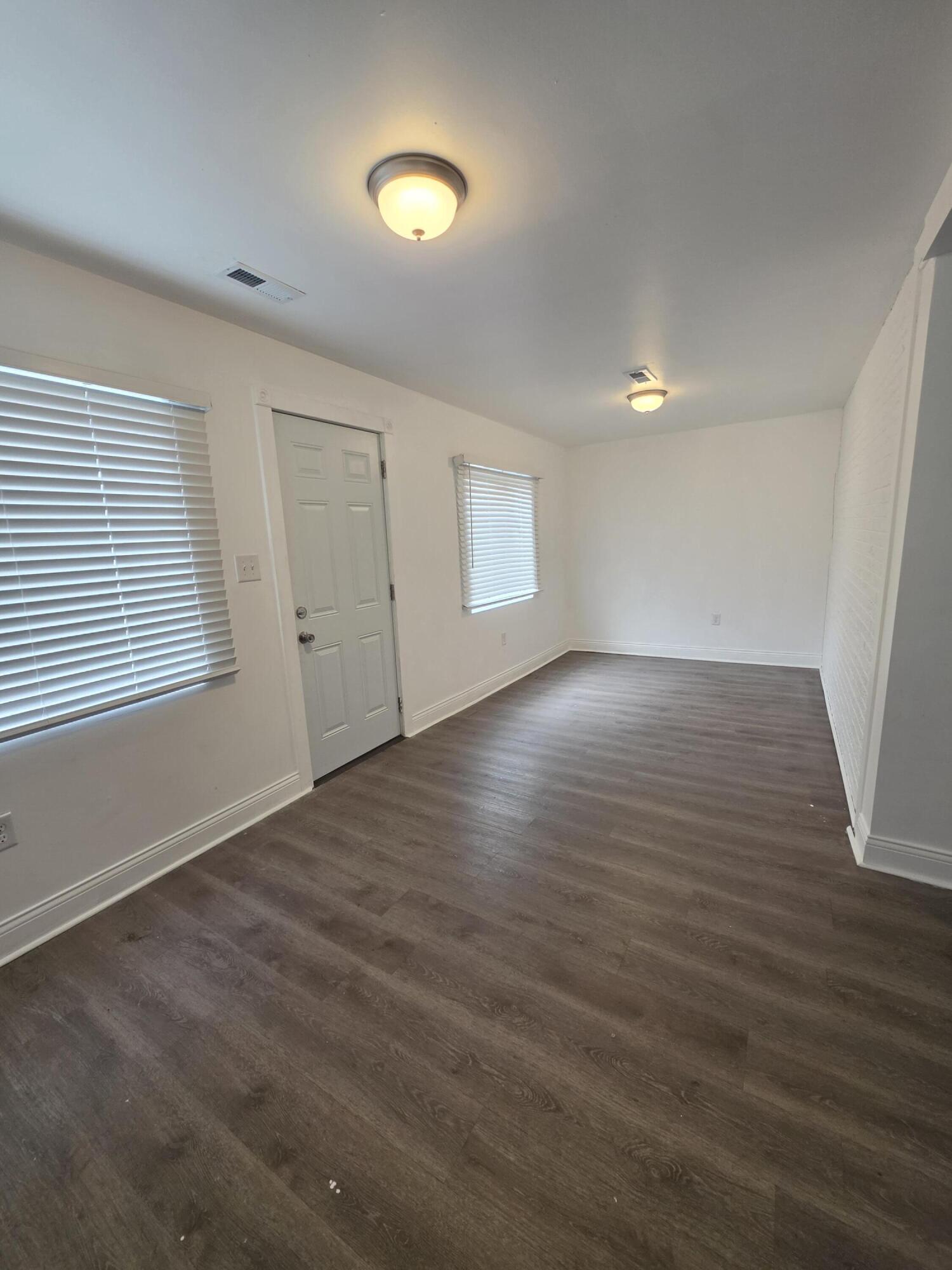 4149 Broadway Gary, IN 46409 - Photo 8 of 26 an empty room with wooden floor and windows