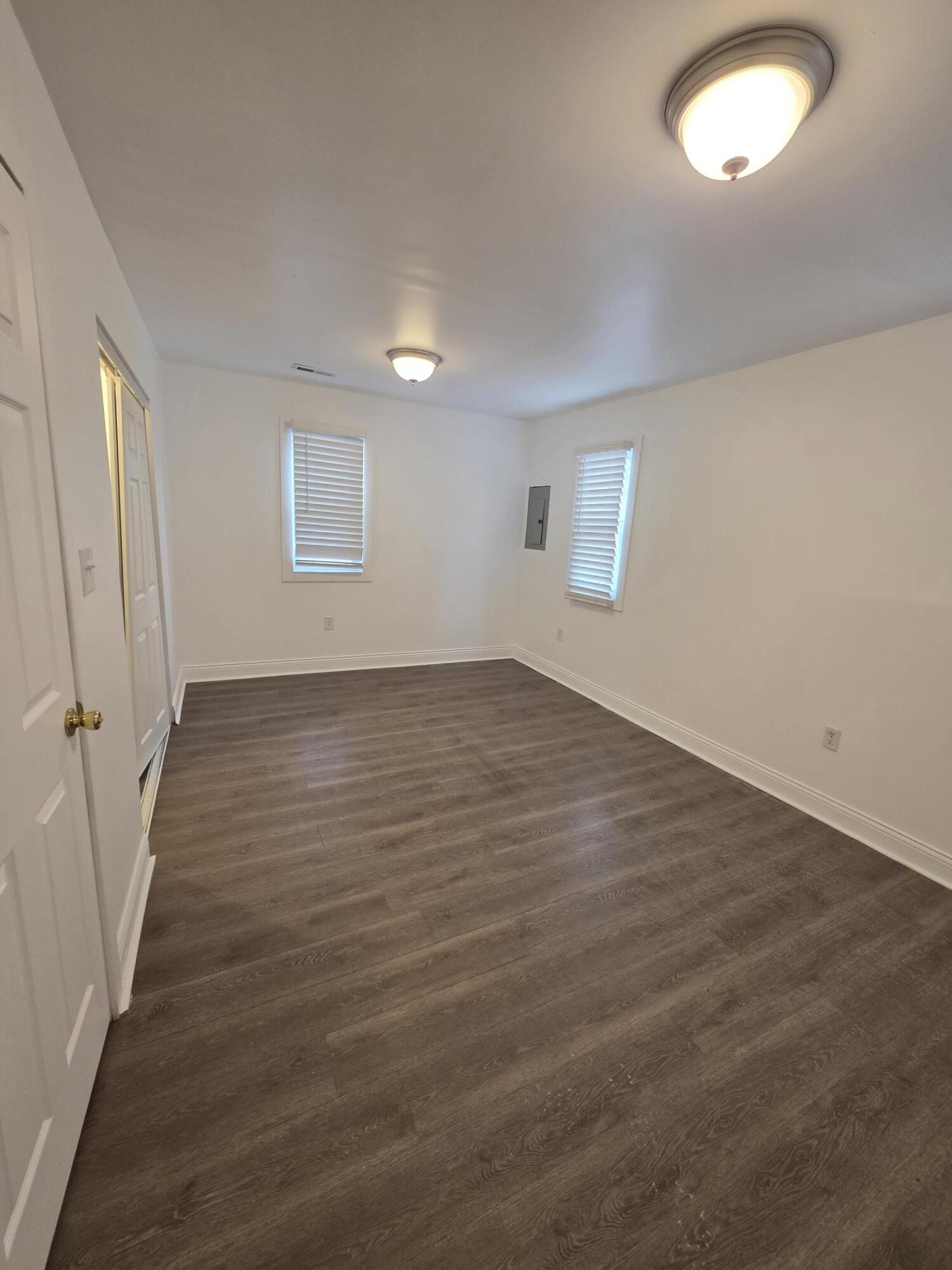 4149 Broadway Gary, IN 46409 - Photo 9 of 26 an empty room with wooden floor and windows