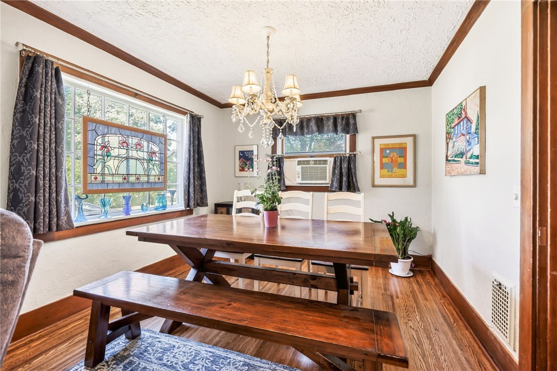 66 Hardison Road Irondequoit, NY 14617 - Photo 9 of 28 Light filled Formal Dining Room with refinished ha