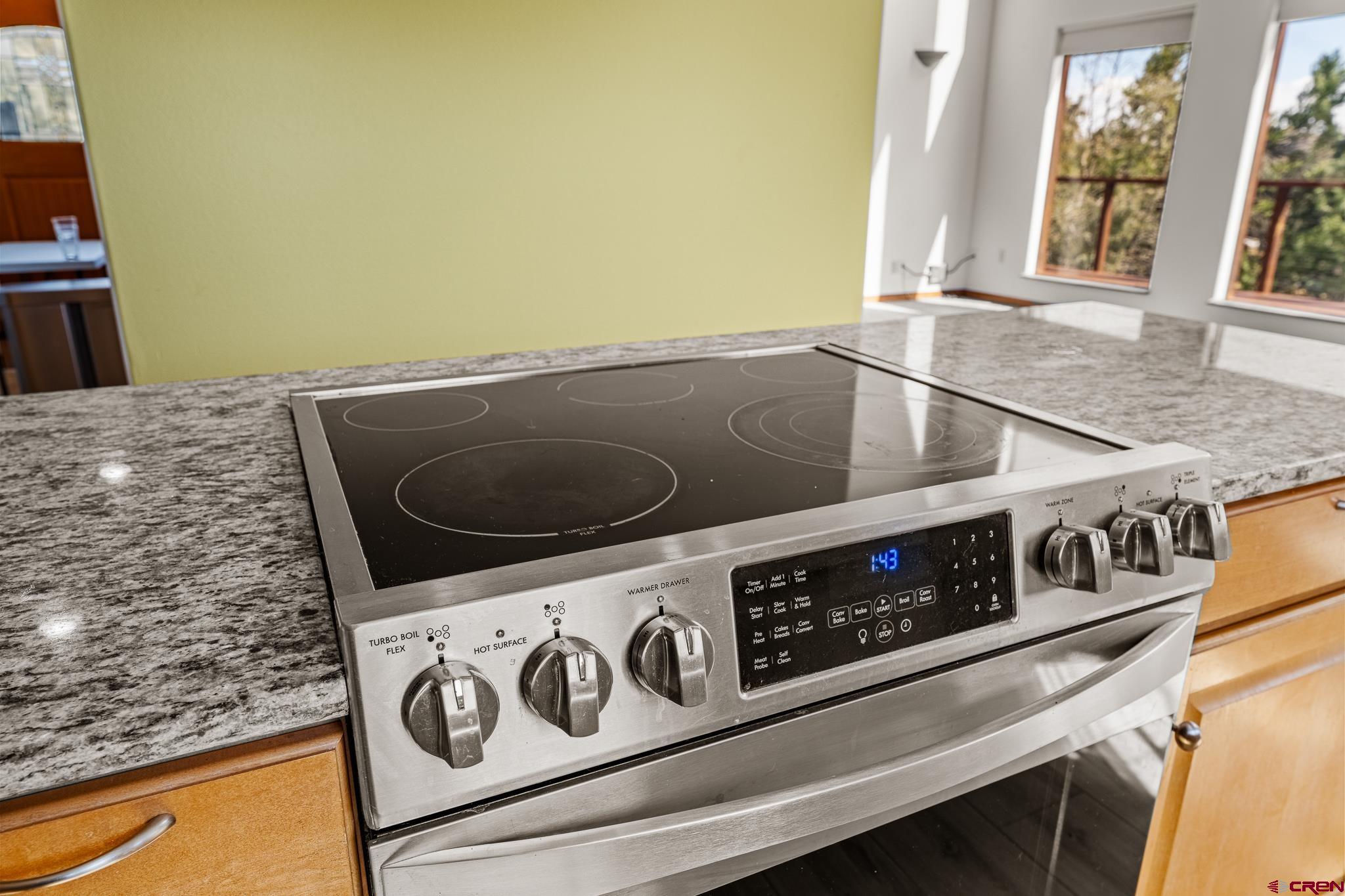 199 Logging Trail Road Durango, CO 81303 - Photo 12 of 33 a kitchen with a stove and a microwave