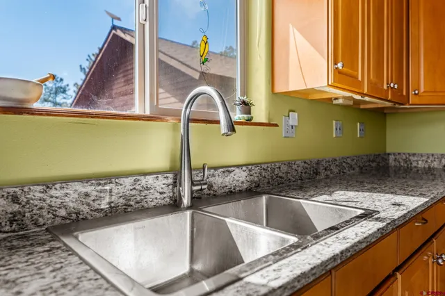 a kitchen with a sink and a window