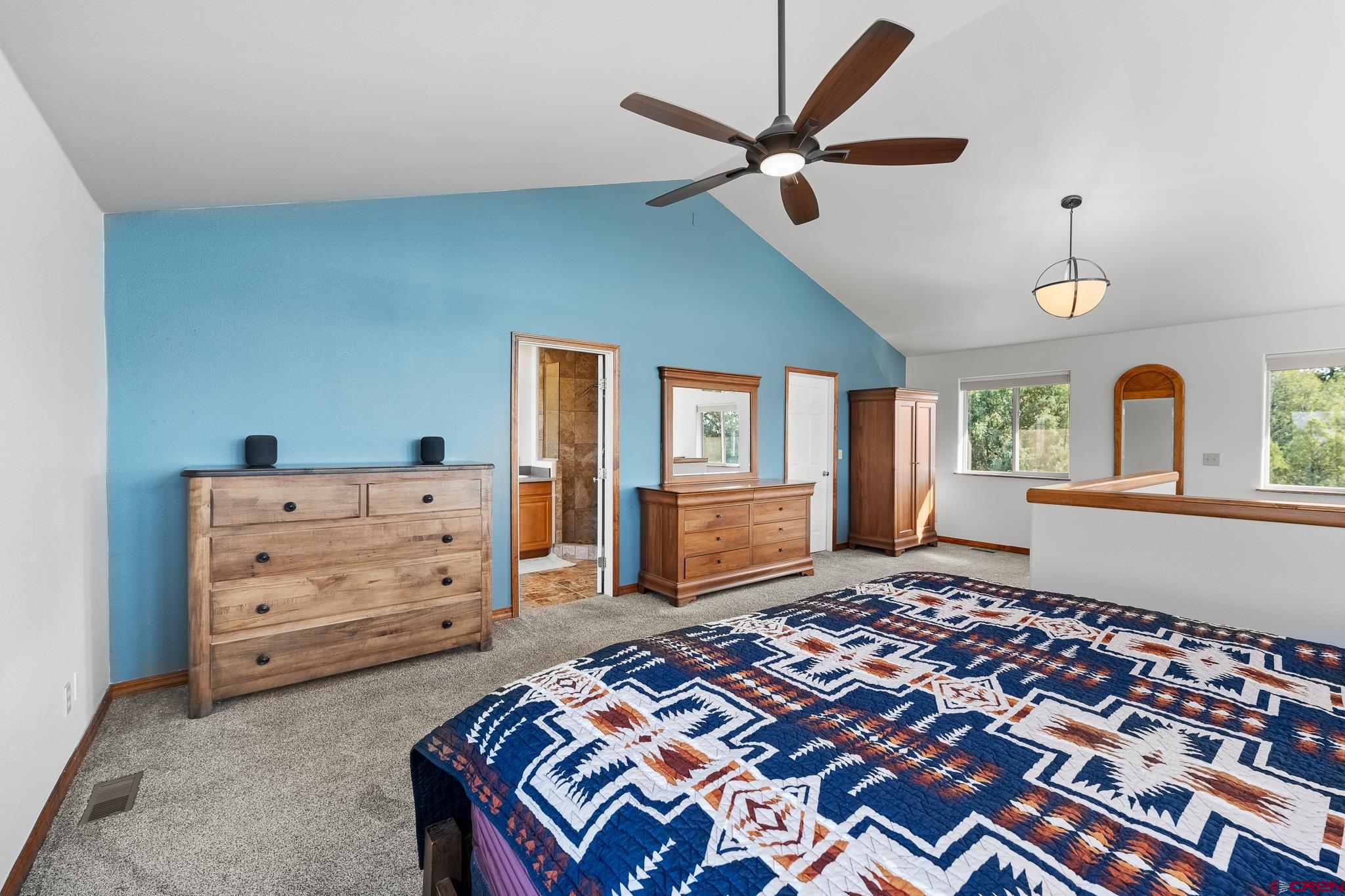 199 Logging Trail Road Durango, CO 81303 - Photo 18 of 33 a bedroom with a bed and a dresser
