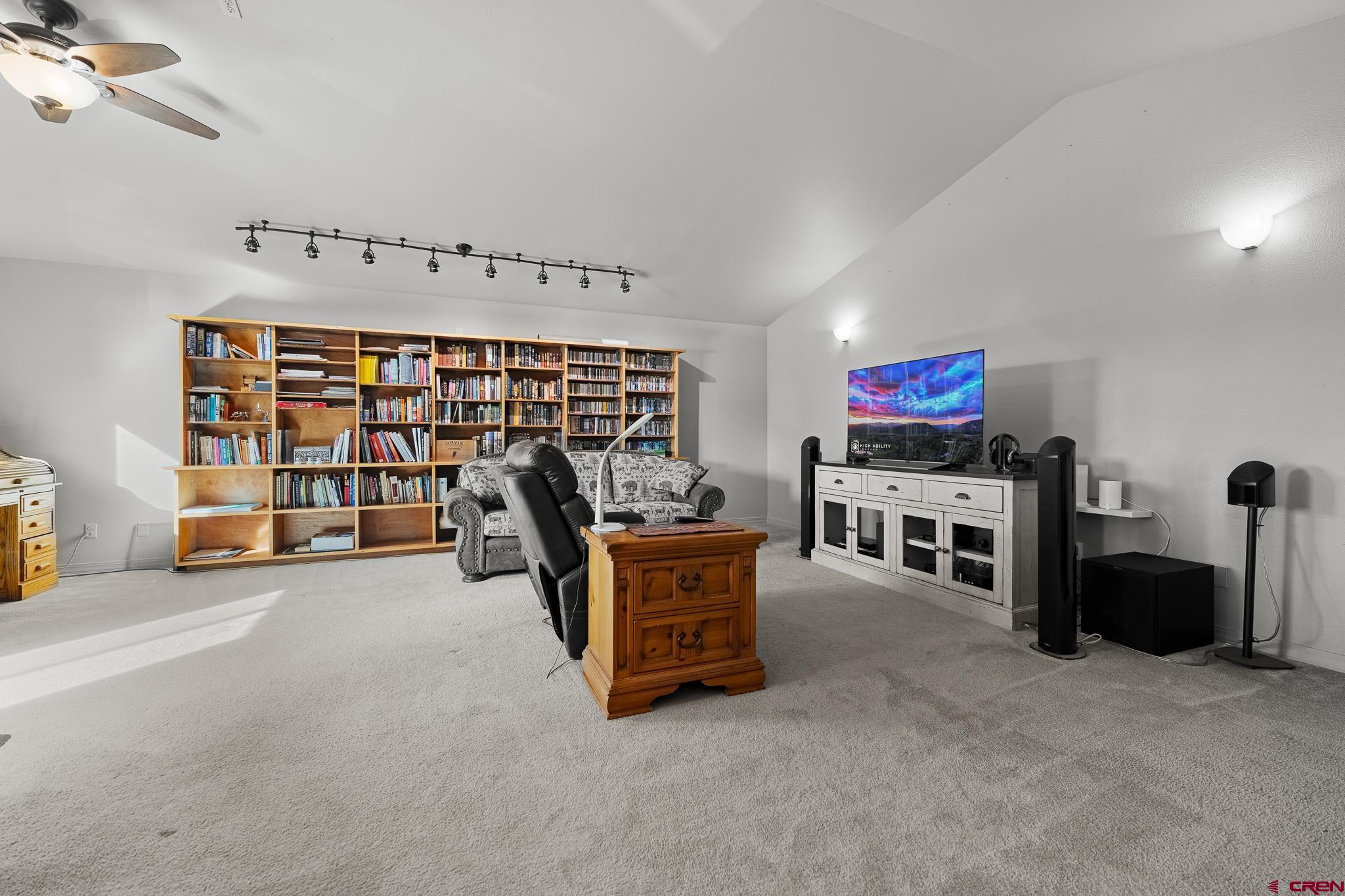 199 Logging Trail Road Durango, CO 81303 - Photo 22 of 33 a living room with furniture and a flat screen tv