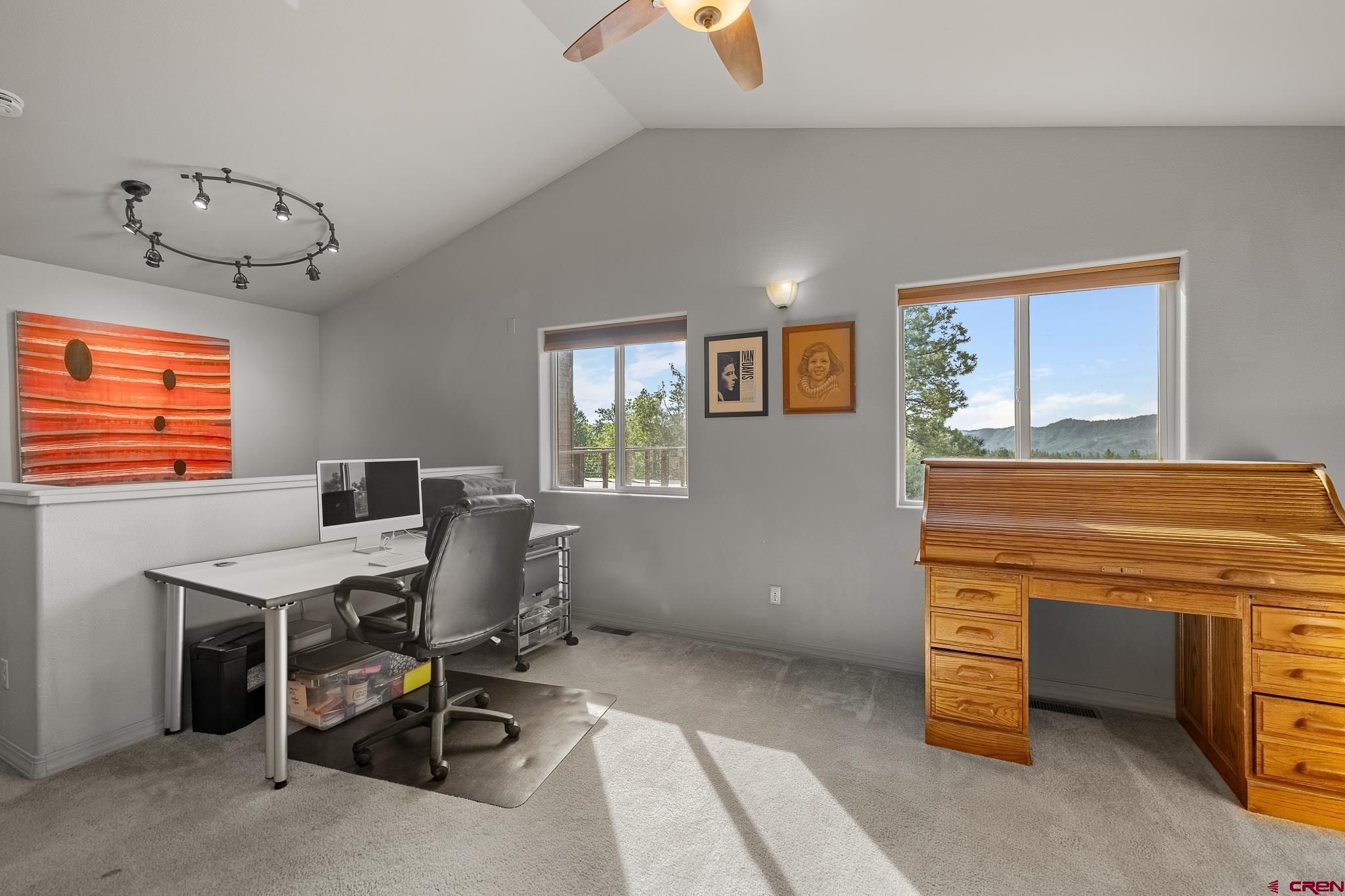 199 Logging Trail Road Durango, CO 81303 - Photo 23 of 33 a view of a workspace with furniture and a window