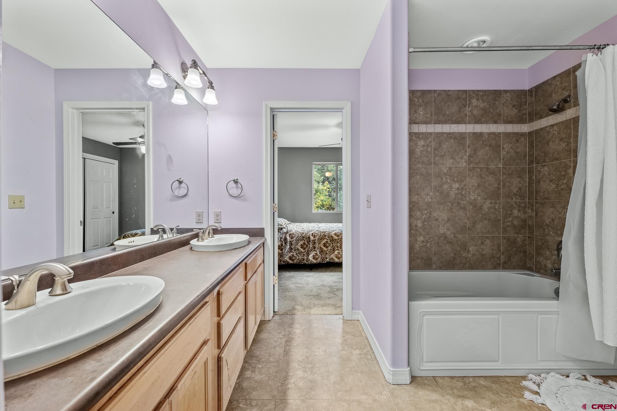 199 Logging Trail Road Durango, CO 81303 - Photo 26 of 33 a en suite spacious bathroom with a tub shower and sink