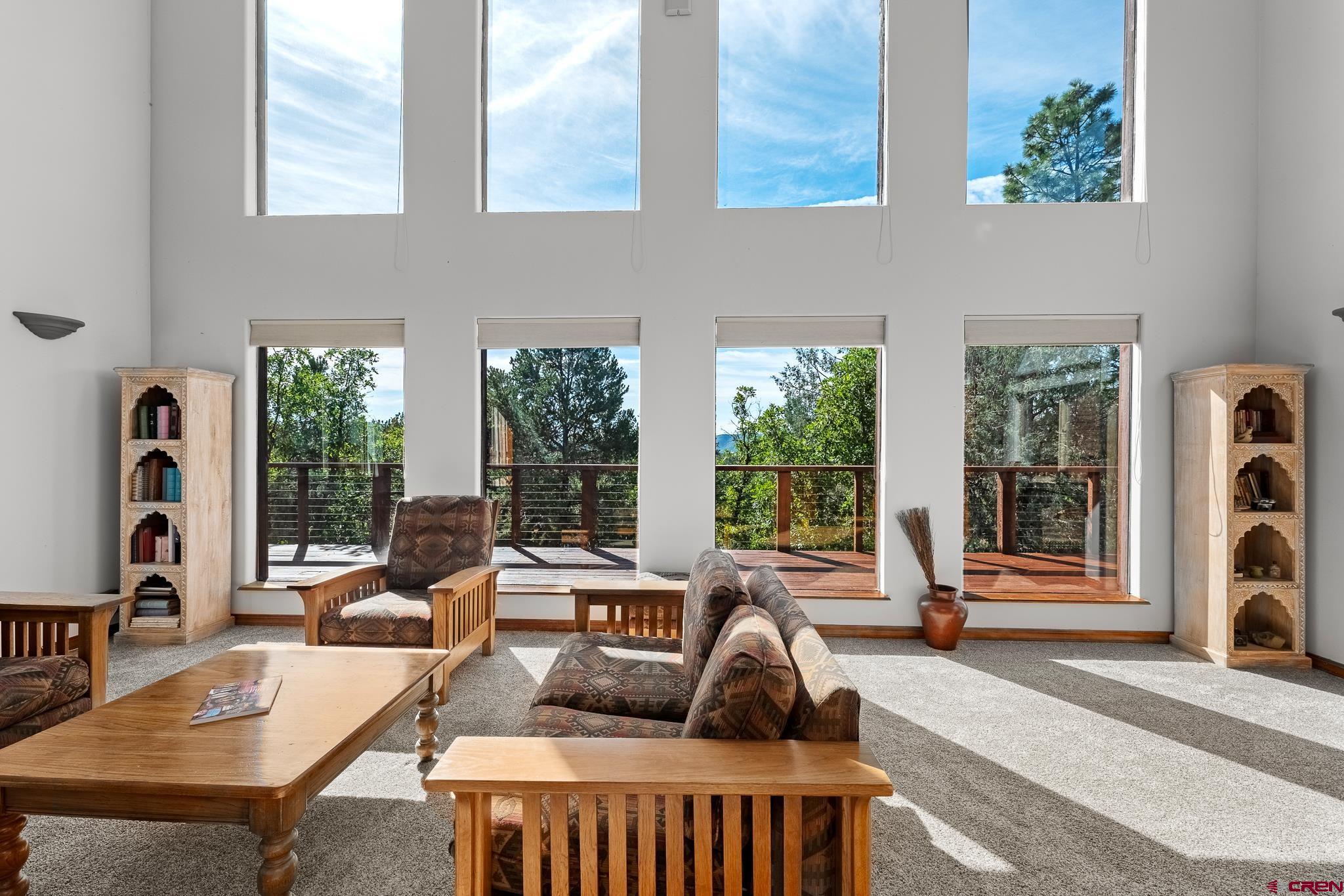 199 Logging Trail Road Durango, CO 81303 - Photo 3 of 33 a living room with furniture a window and a potted plant