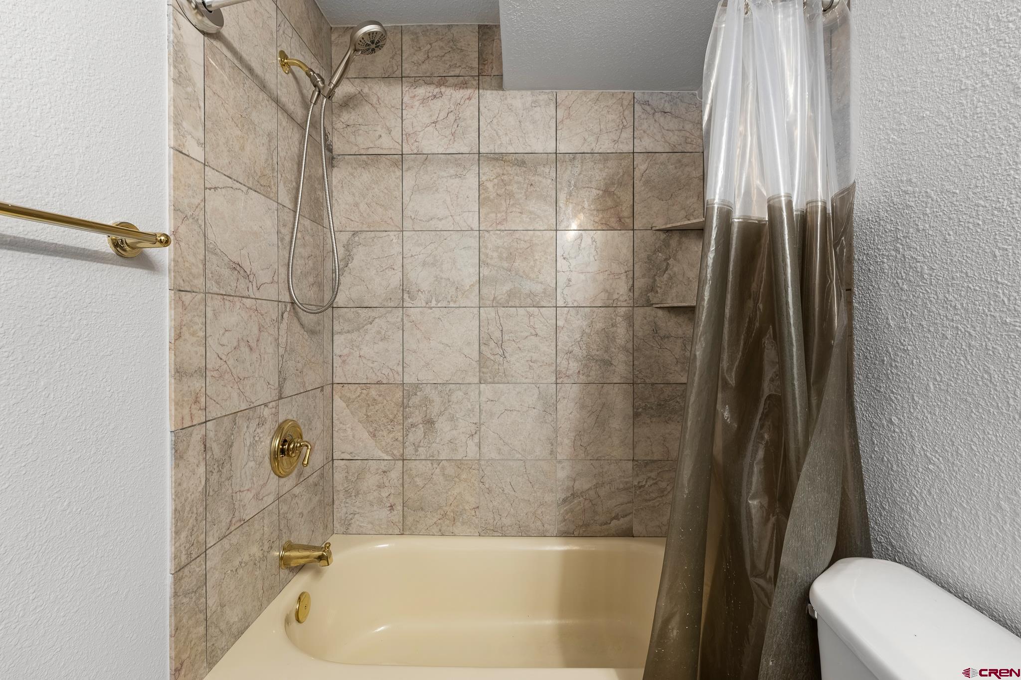 199 Logging Trail Road Durango, CO 81303 - Photo 33 of 33 a bathroom with a bathtub and a shower