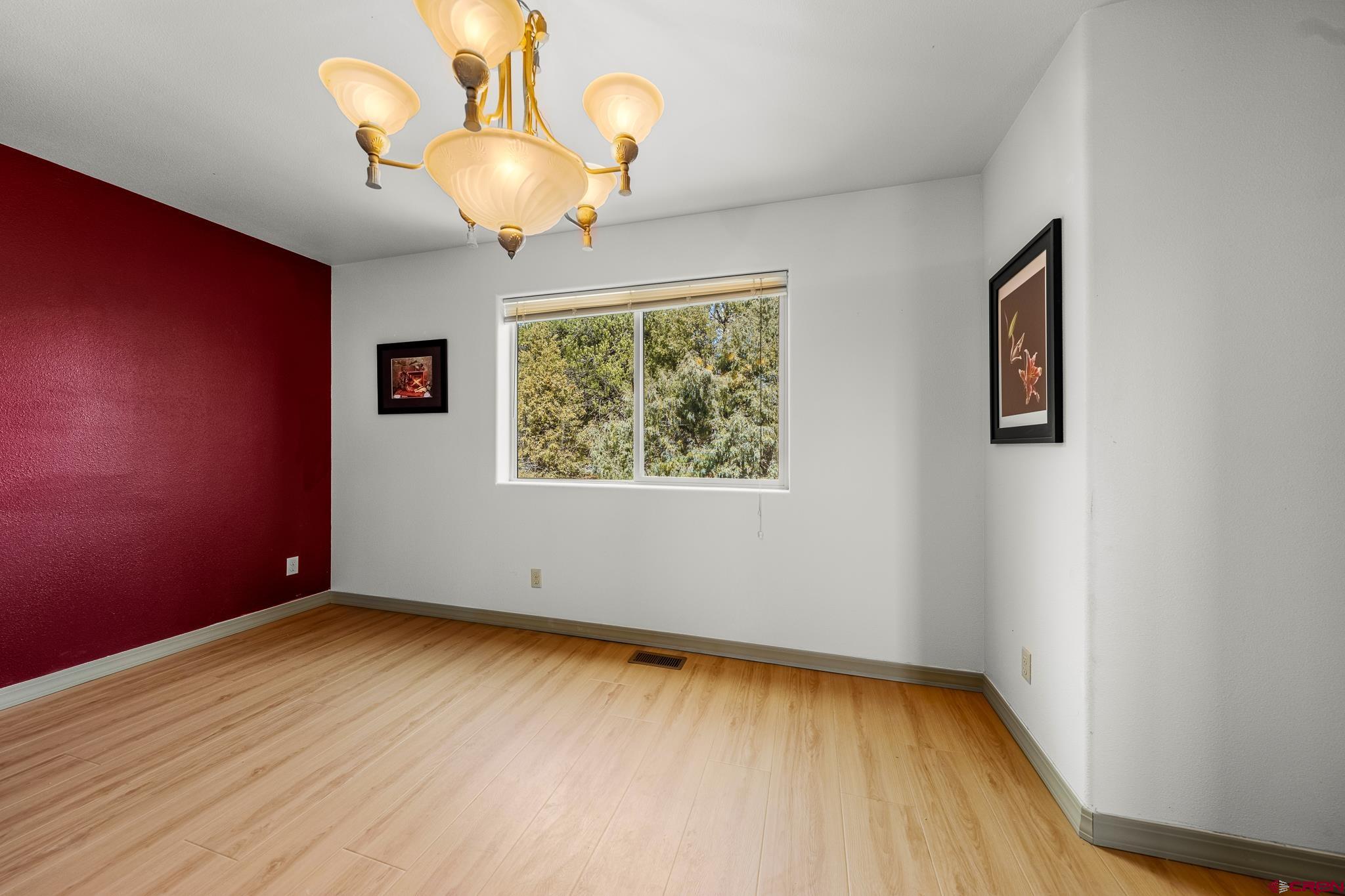 199 Logging Trail Road Durango, CO 81303 - Photo 8 of 33 a view of room with window and wooden floor