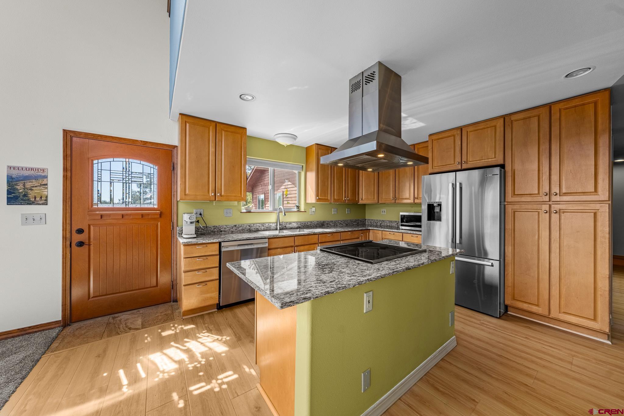 199 Logging Trail Road Durango, CO 81303 - Photo 10 of 33 a kitchen with stainless steel appliances granite countertop a refrigerator a stove and a sink