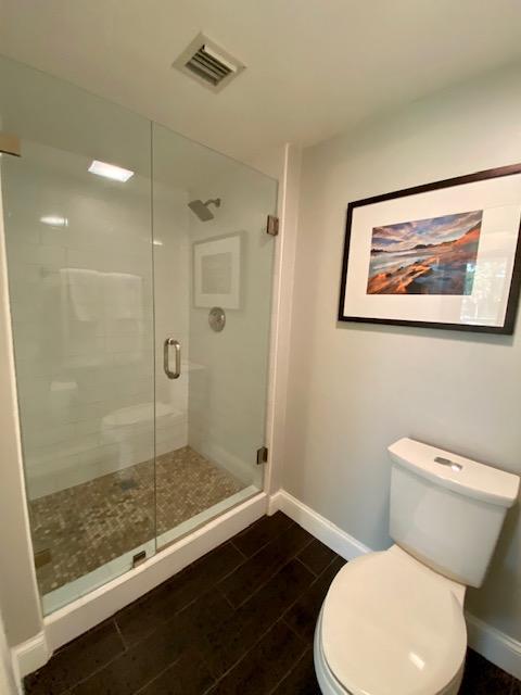 6181 Balboa Circle, Unit 205 Boca Raton, FL 33433 - Photo 13 of 27 a white toilet sitting next to a bathroom sink