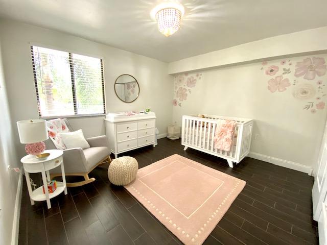 6181 Balboa Circle, Unit 205 Boca Raton, FL 33433 - Photo 17 of 27 a bedroom with furniture and a window