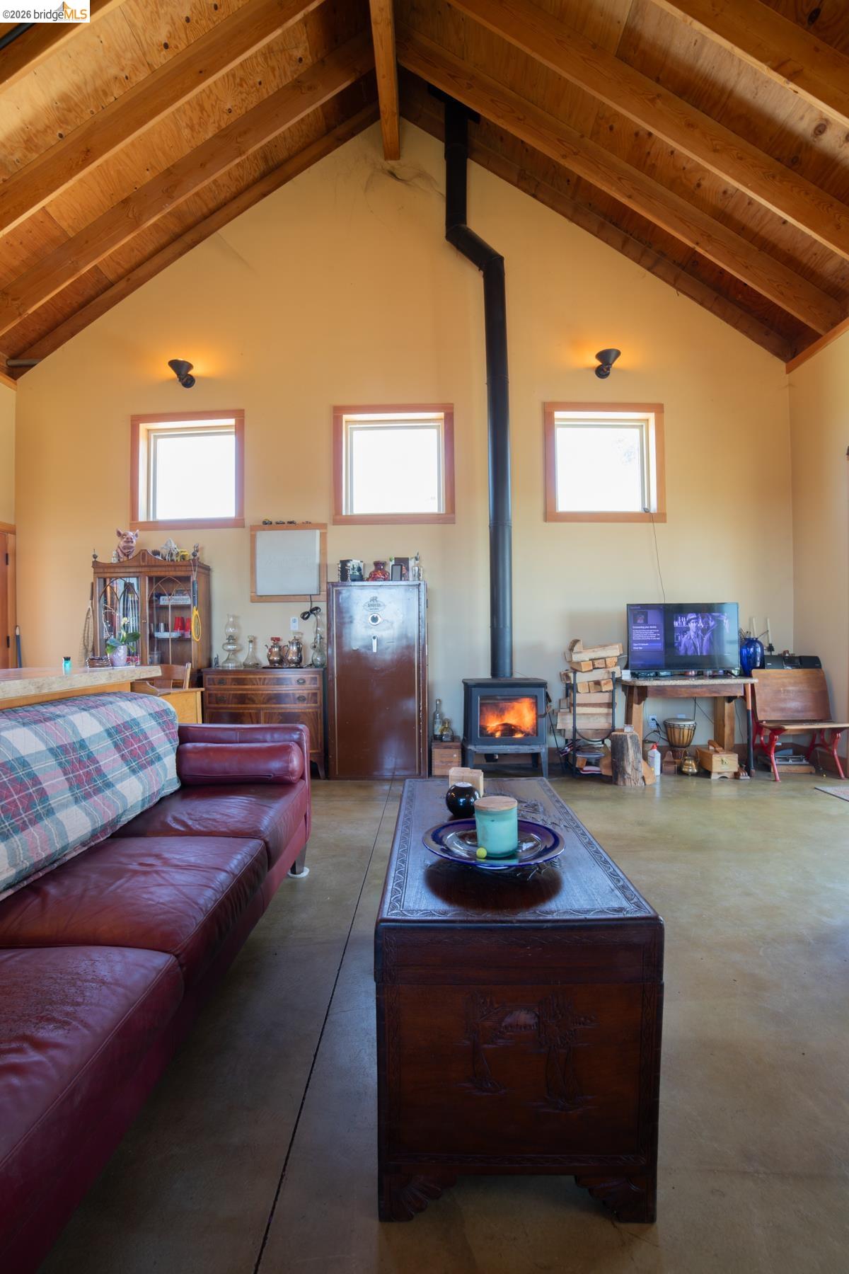 6899 Eagle View Drive Mountain Ranch, CA 95246 - Photo 12 of 35 a living room with furniture a table and a fireplace