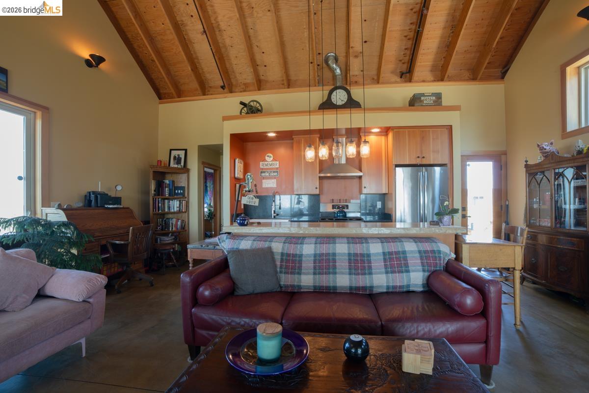 6899 Eagle View Drive Mountain Ranch, CA 95246 - Photo 14 of 35 a living room with furniture and a chandelier