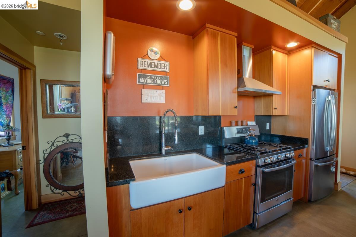 6899 Eagle View Drive Mountain Ranch, CA 95246 - Photo 17 of 35 a kitchen with stainless steel appliances granite countertop a stove and a refrigerator