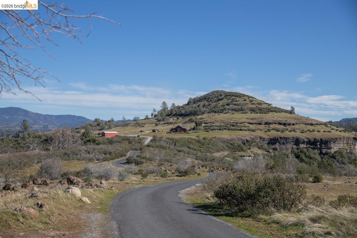 6899 Eagle View Drive Mountain Ranch, CA 95246 - Photo 19 of 35 a view of a lake with a mountain in the background