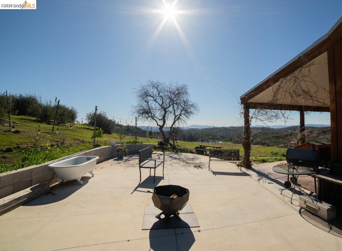 6899 Eagle View Drive Mountain Ranch, CA 95246 - Photo 24 of 35 a swimming pool view with a garden space