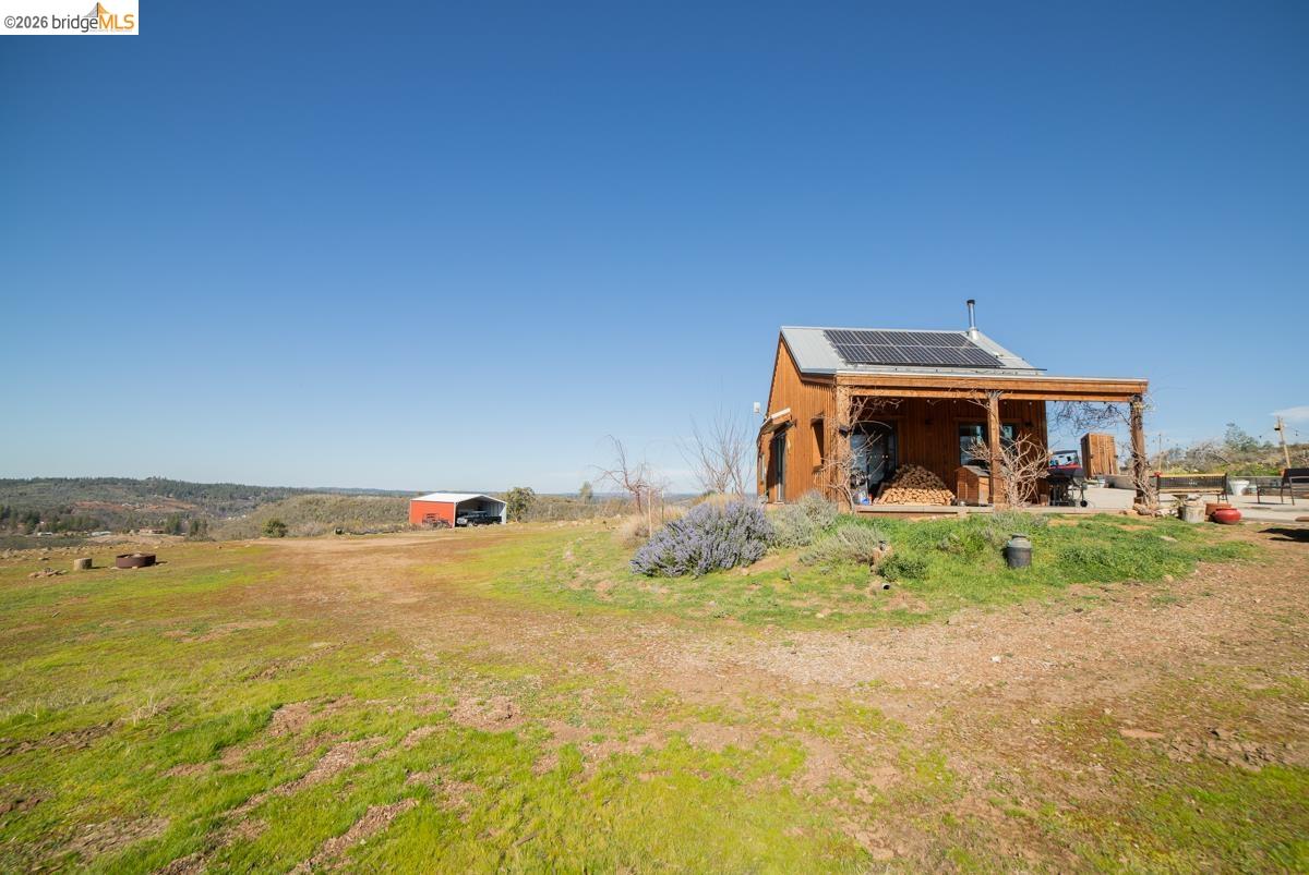 6899 Eagle View Drive Mountain Ranch, CA 95246 - Photo 26 of 35 a front view of a house with a yard