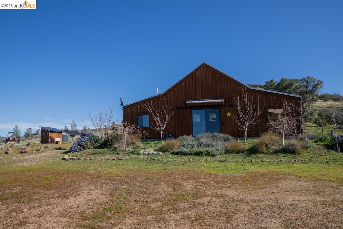 6899 Eagle View Drive Mountain Ranch, CA 95246 - Photo 3 of 35 a house with green field in front of it