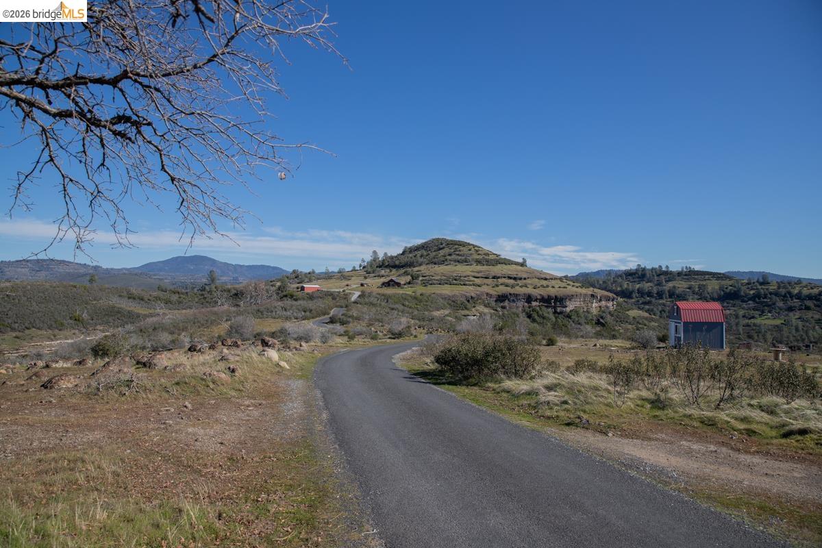 6899 Eagle View Drive Mountain Ranch, CA 95246 - Photo 33 of 35 a view of a dry yard with wooden fence