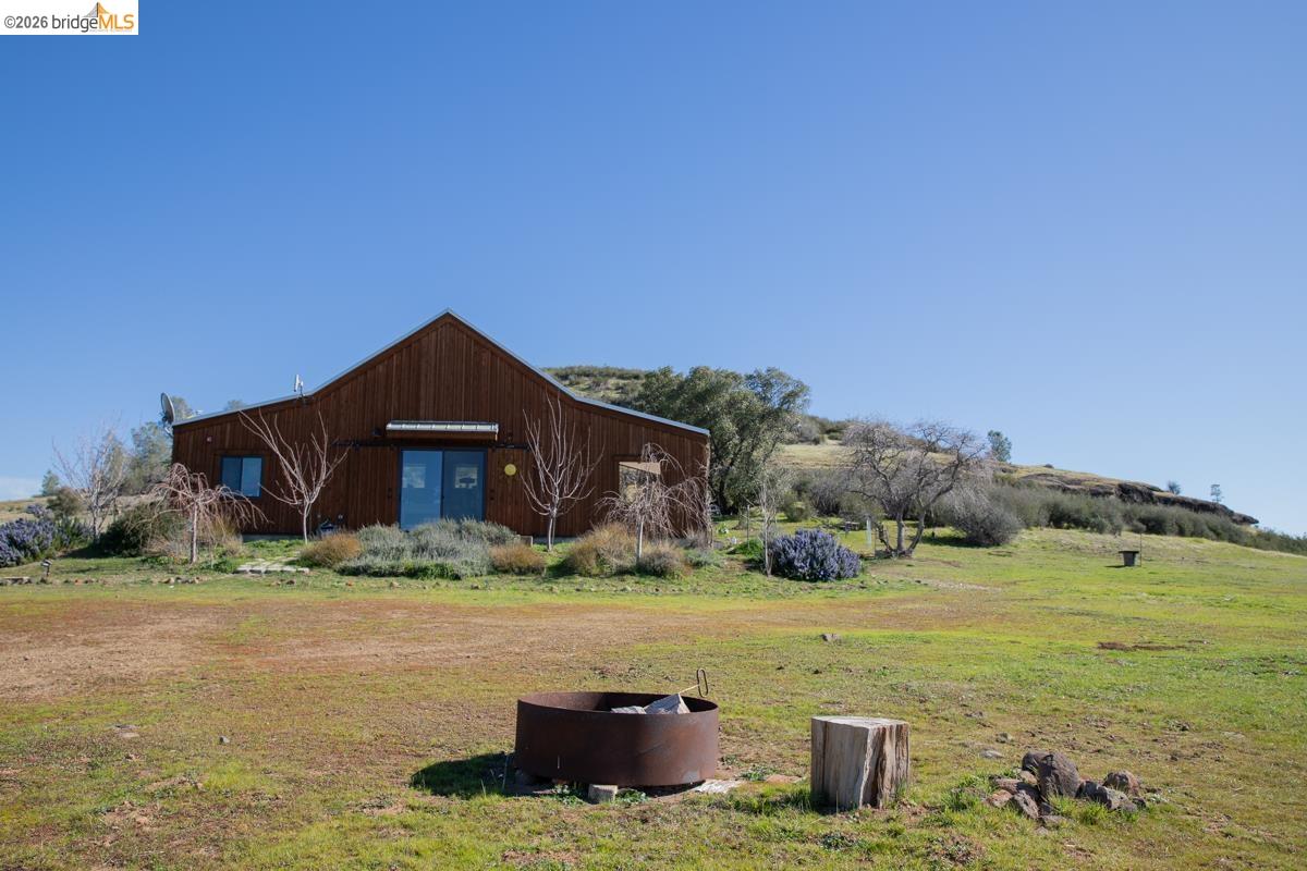 6899 Eagle View Drive Mountain Ranch, CA 95246 - Photo 4 of 35 a view of a house with a yard