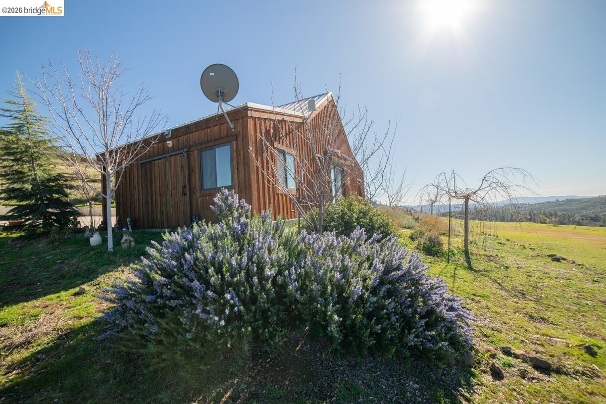 6899 Eagle View Drive Mountain Ranch, CA 95246 - Photo 10 of 35 a view of a backyard of the house