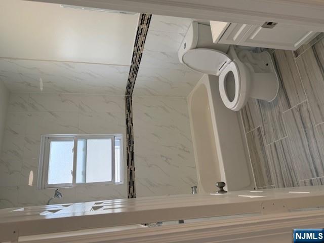 611 South 19th Street, Unit 2 Newark, NJ 07103 - Photo 3 of 8 a bathroom with a toilet and a bathtub