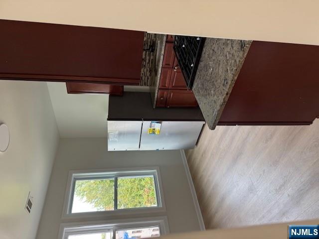 611 South 19th Street, Unit 2 Newark, NJ 07103 - Photo 8 of 8 a kitchen with a refrigerator and a stove top oven