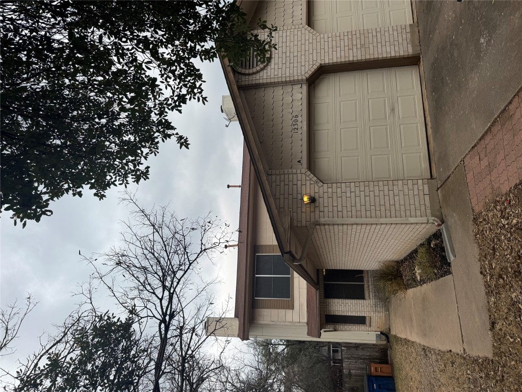 a front view of a house with garage