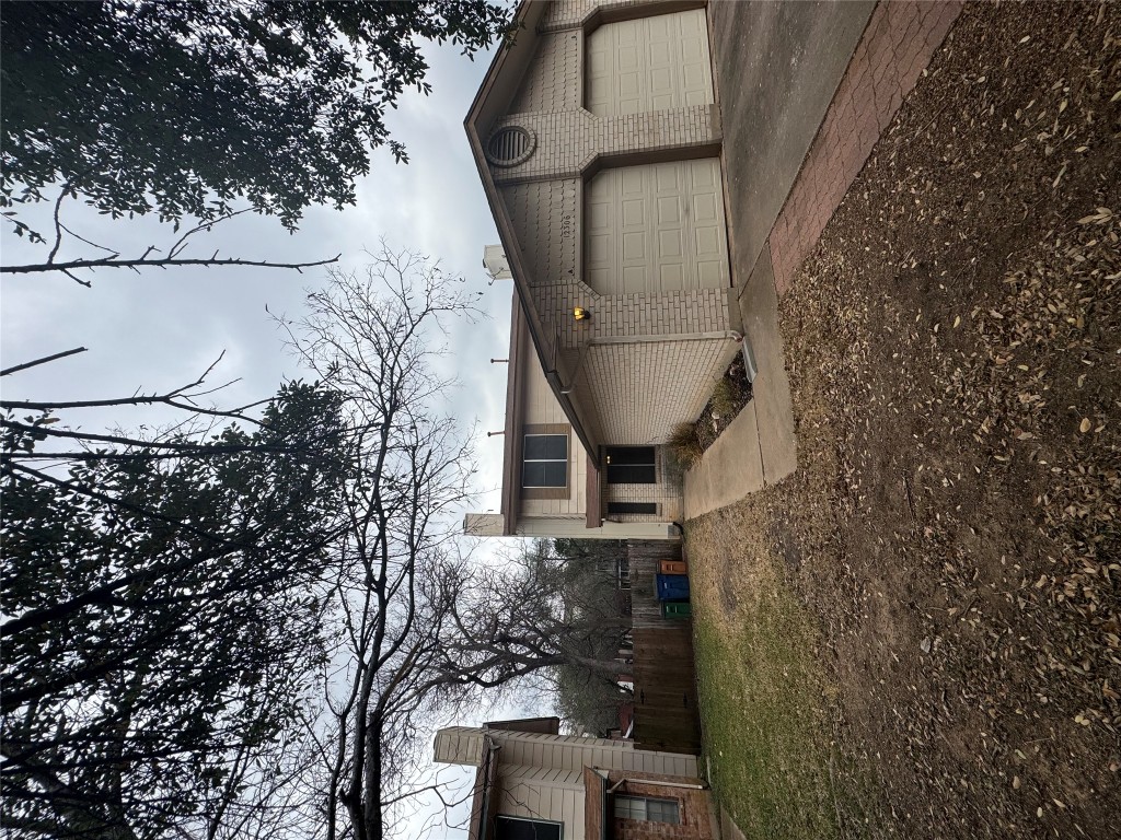 12306 Cahone Trail, Unit A Austin, TX 78729 - Photo 2 of 25 a view of a house with a snow in the yard