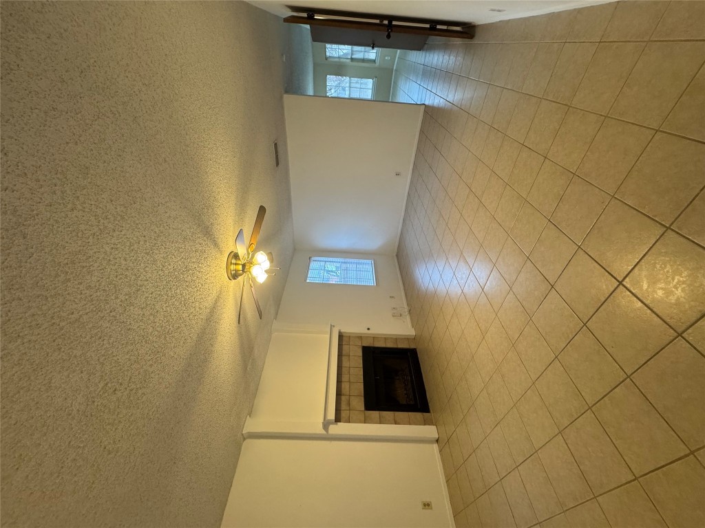 12306 Cahone Trail, Unit A Austin, TX 78729 - Photo 5 of 25 a view of empty room with wooden floor
