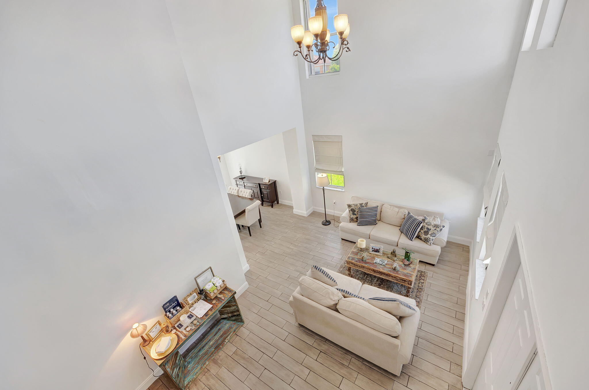 13838 Southwest 41st Terrace Miami, FL 33175 - Photo 25 of 68 a living room with furniture and a chandelier