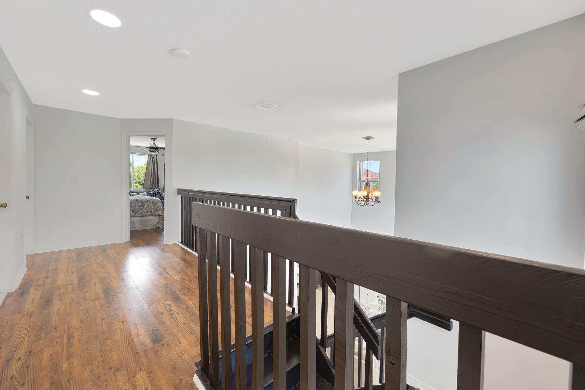 13838 Southwest 41st Terrace Miami, FL 33175 - Photo 26 of 68 a view of a hallway with wooden floor and stairs