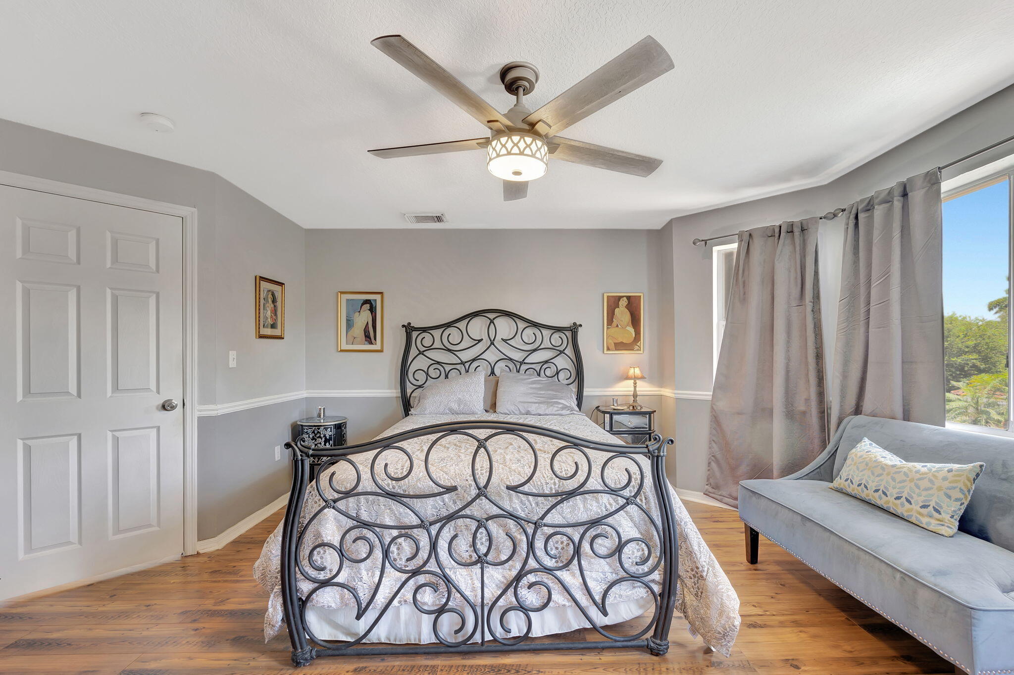 13838 Southwest 41st Terrace Miami, FL 33175 - Photo 32 of 68 a bedroom with a bed and a chandelier