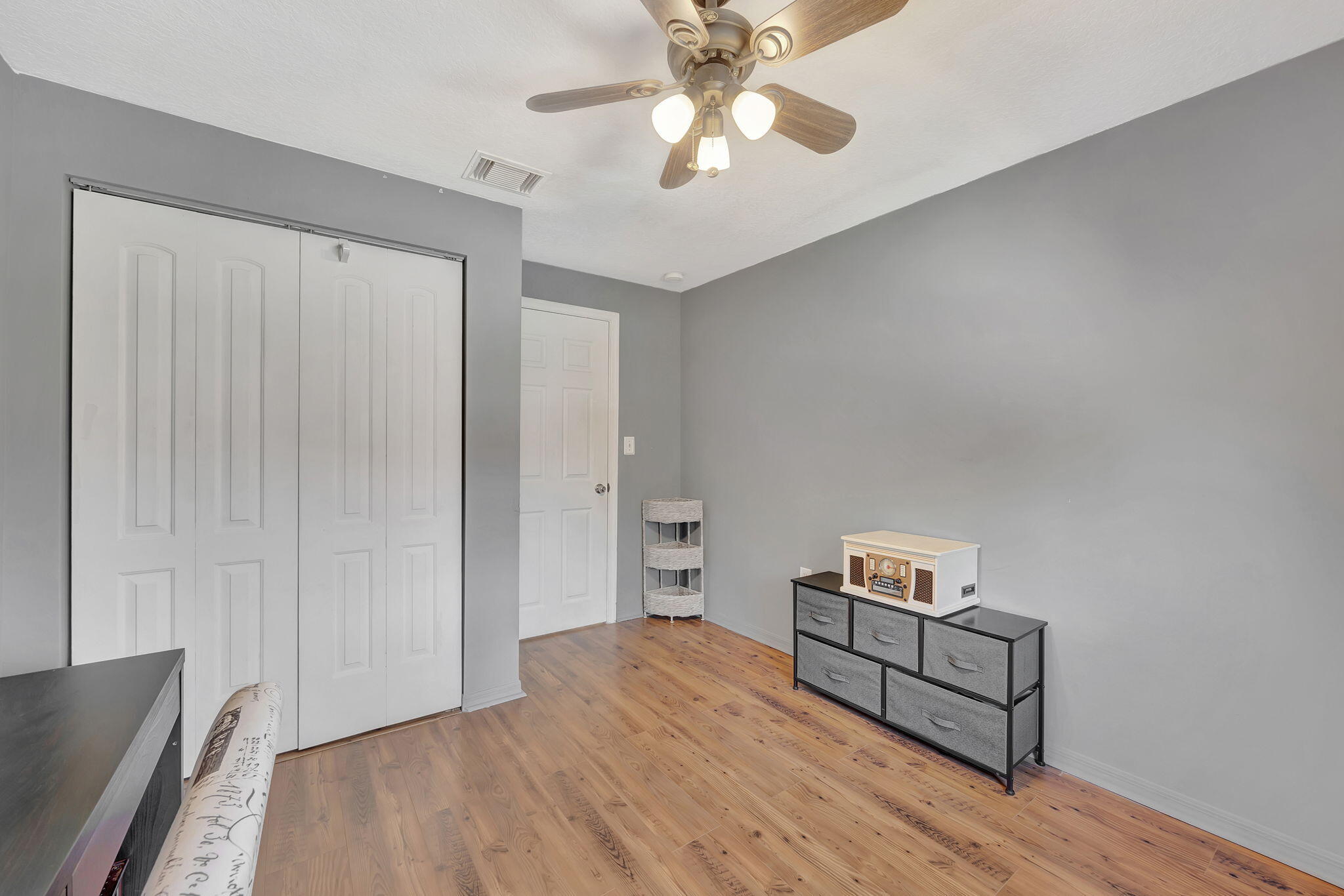 13838 Southwest 41st Terrace Miami, FL 33175 - Photo 38 of 68 a bedroom with a bed and a chandelier